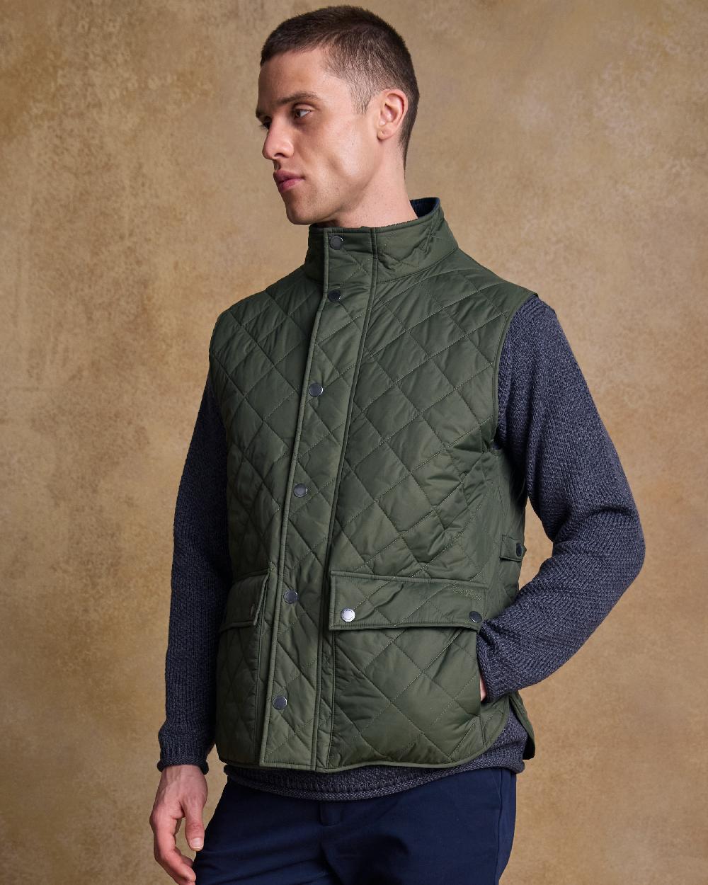 Olive Coloured Jack Murphy Mens Conor Quilted Gilet on indoor background 
