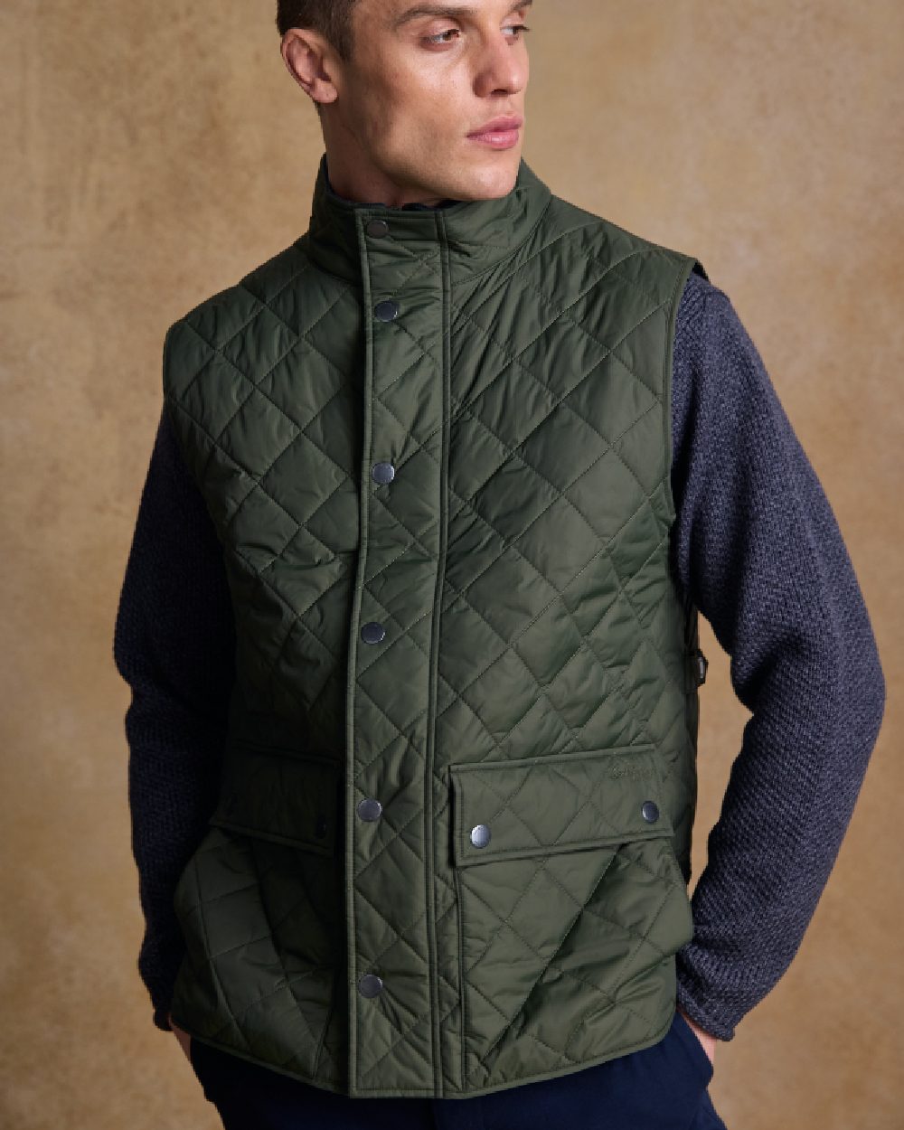 Olive Coloured Jack Murphy Mens Conor Quilted Gilet on indoor background 