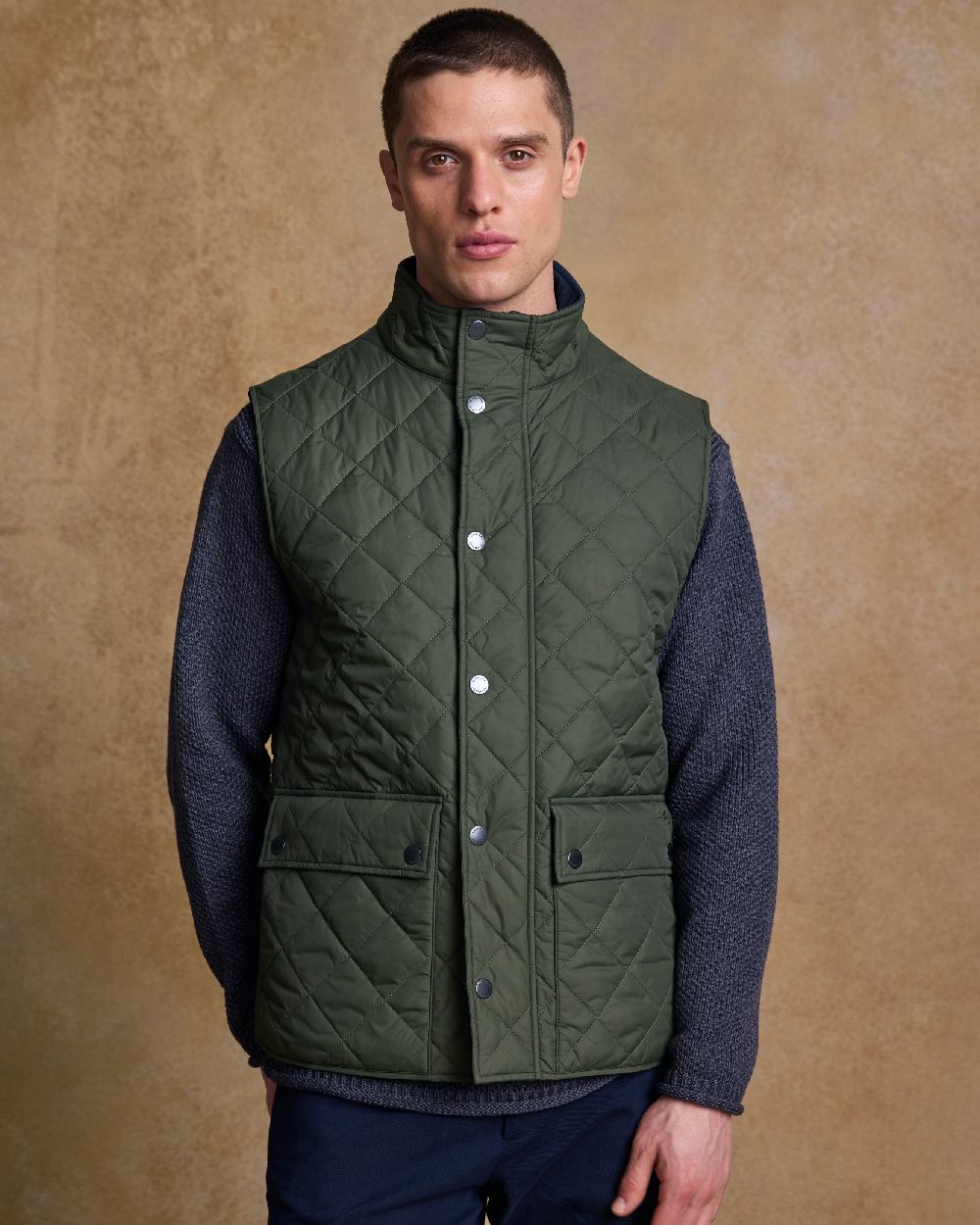 Olive Coloured Jack Murphy Mens Conor Quilted Gilet on indoor background 