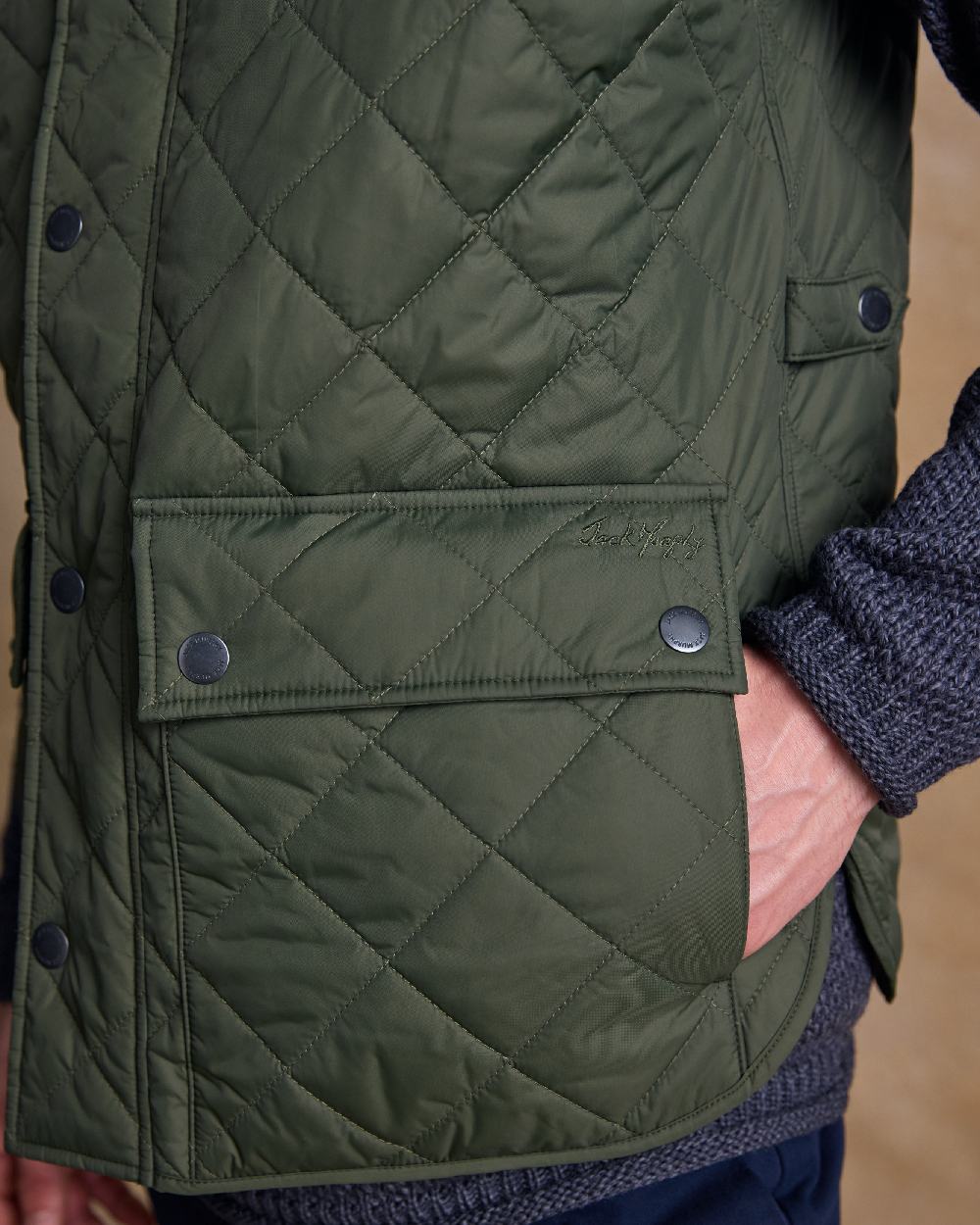 Olive Coloured Jack Murphy Mens Conor Quilted Gilet on indoor background 