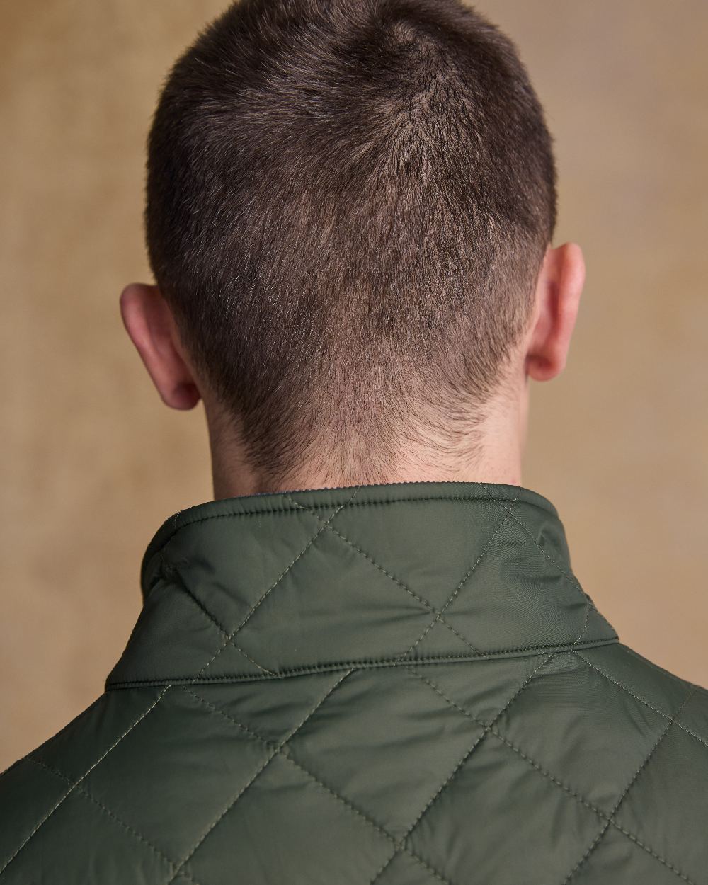 Olive Coloured Jack Murphy Mens Conor Quilted Gilet on indoor background 