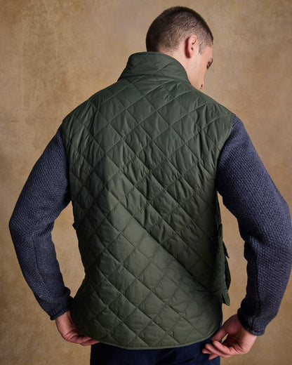 Olive Coloured Jack Murphy Mens Conor Quilted Gilet on indoor background 