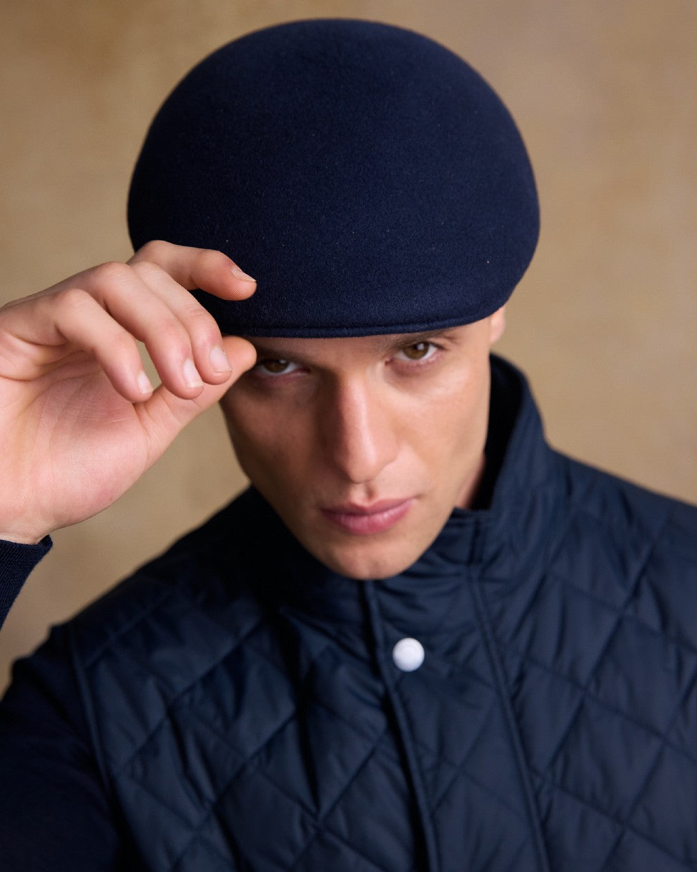 True Navy Coloured Jack Murphy Mens Galway Felt Flat Cap on indoor background 