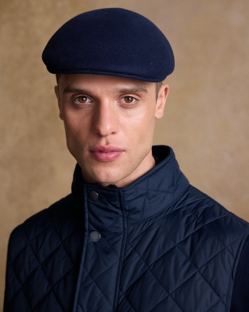 True Navy Coloured Jack Murphy Mens Galway Felt Flat Cap on indoor background 