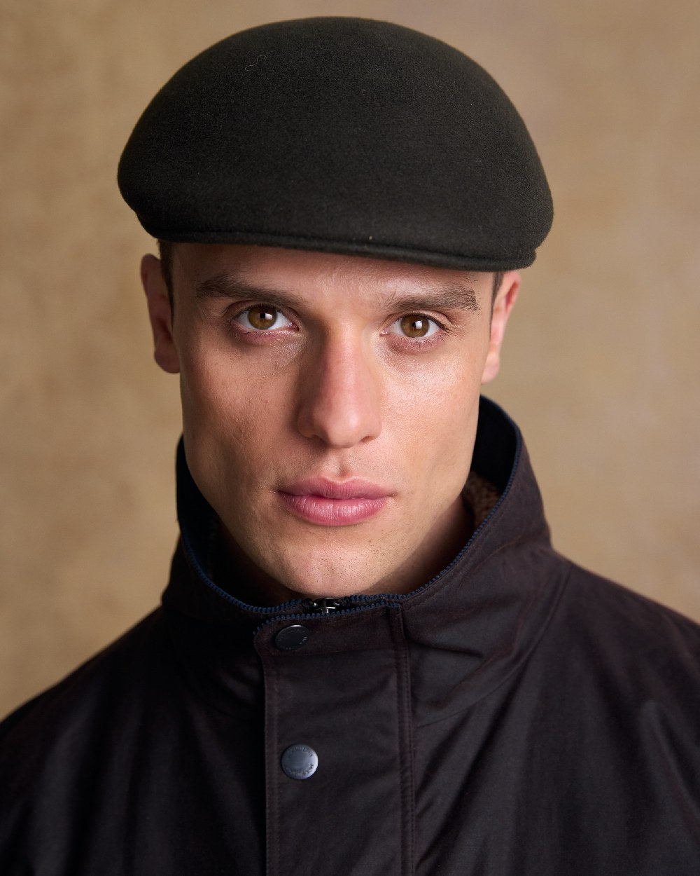 Olive Coloured Jack Murphy Mens Galway Felt Flat Cap on indoor background 