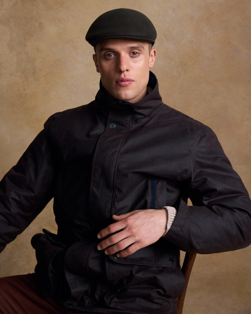 Olive Coloured Jack Murphy Mens Galway Felt Flat Cap on indoor background 