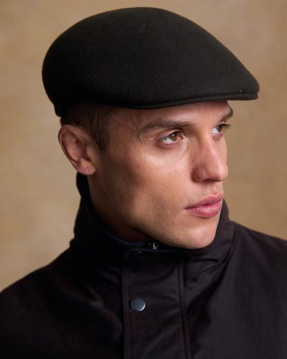 Olive Coloured Jack Murphy Mens Galway Felt Flat Cap on indoor background 