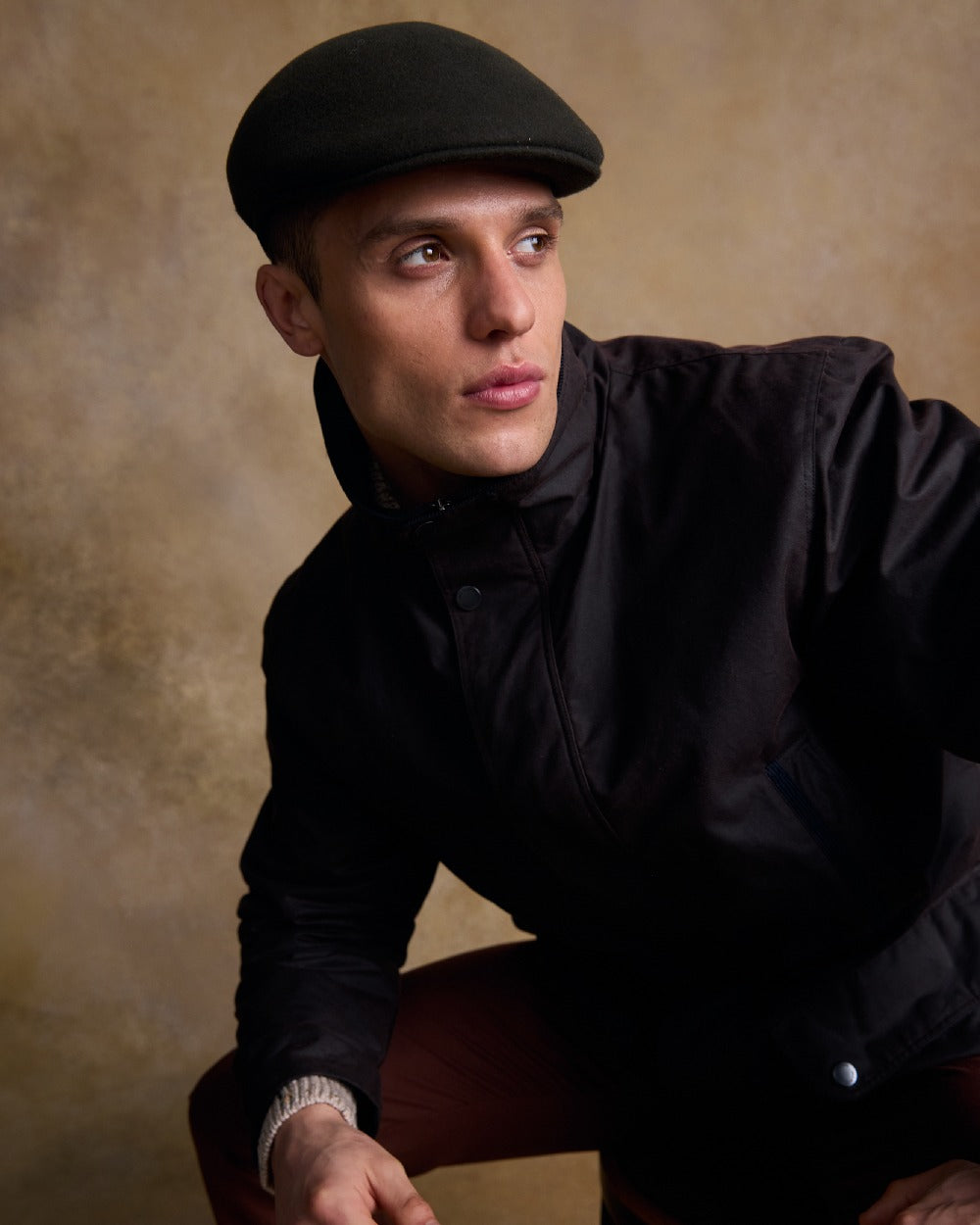 Olive Coloured Jack Murphy Mens Galway Felt Flat Cap on indoor background 