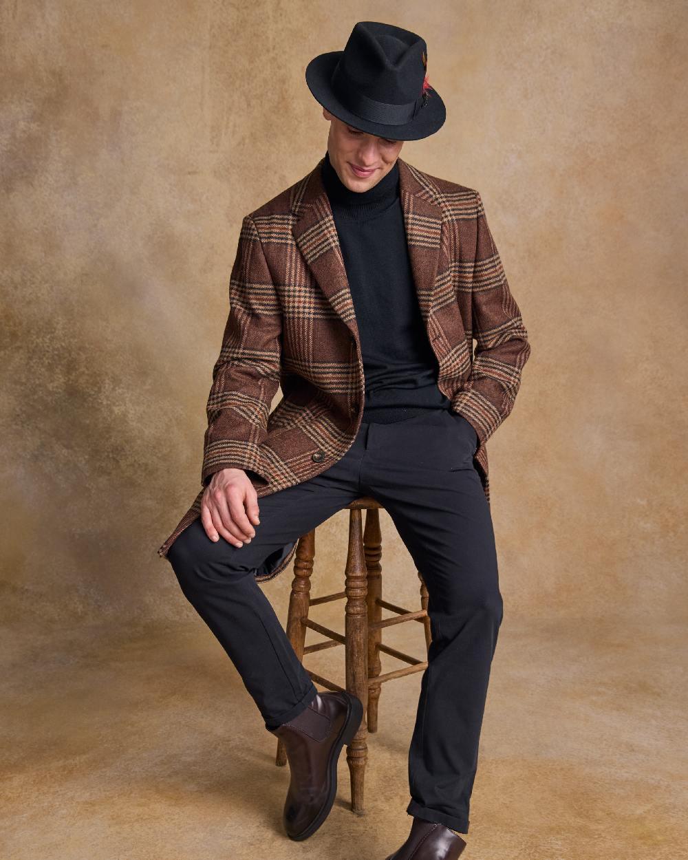 Black Coloured Jack Murphy Mens Kildare Trilby Felt Hat on indoor background 