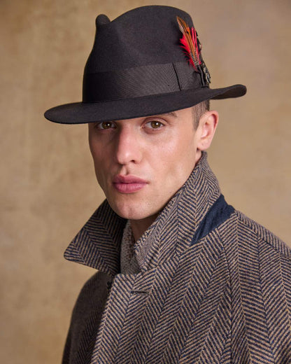 Brown Coloured Jack Murphy Mens Kildare Trilby Felt Hat on indoor background 