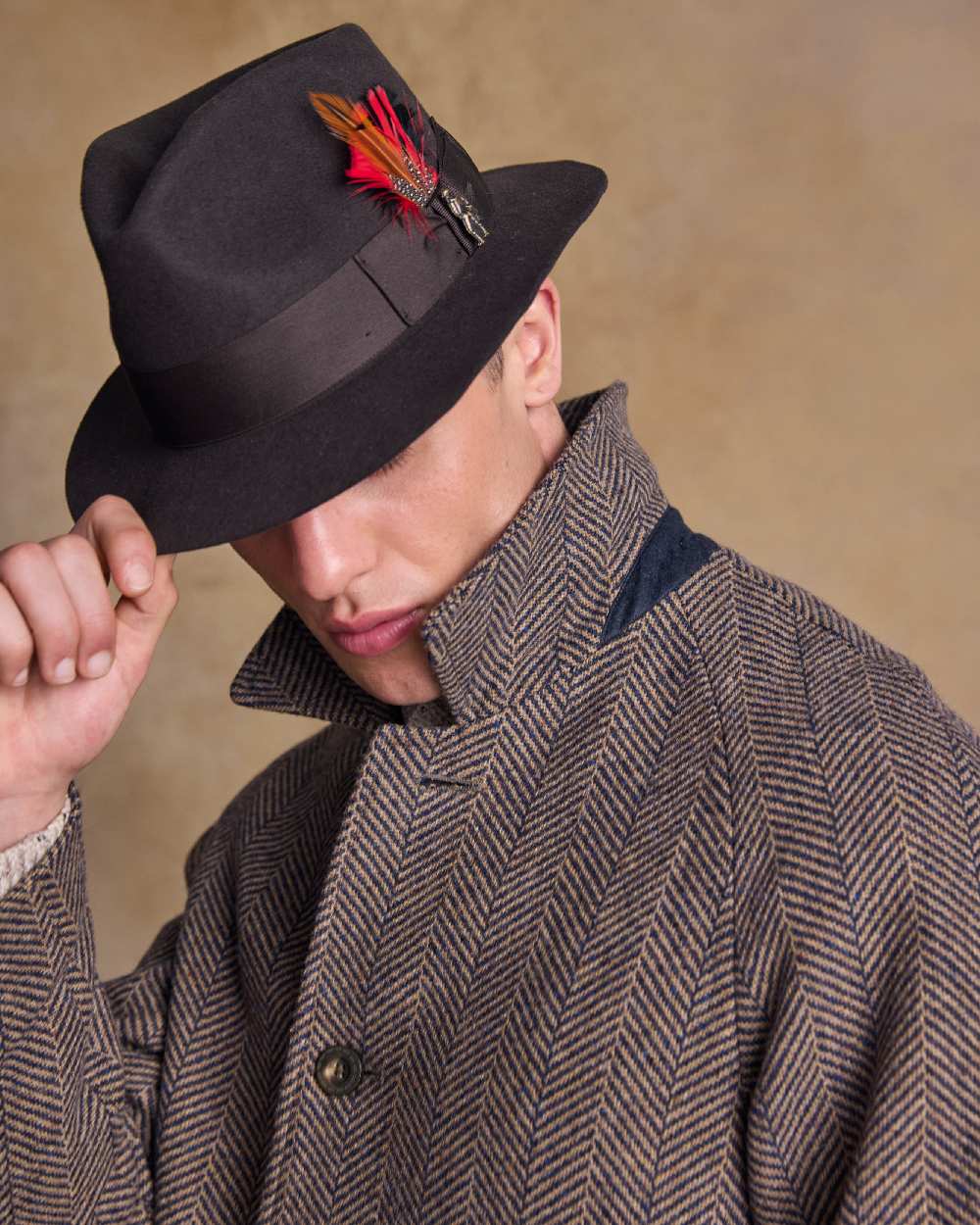 Brown Coloured Jack Murphy Mens Kildare Trilby Felt Hat on indoor background 