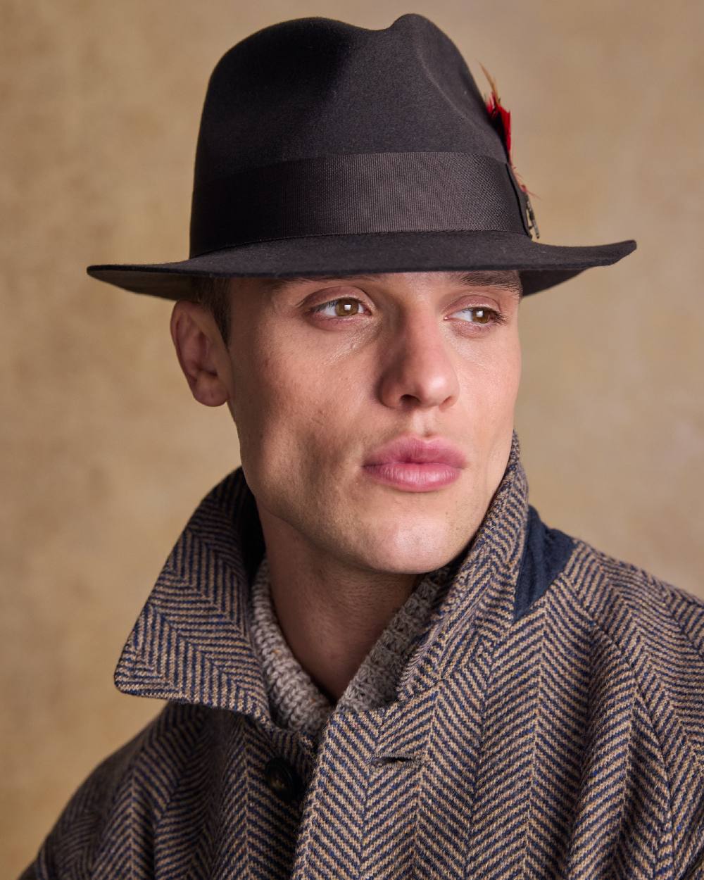 Brown Coloured Jack Murphy Mens Kildare Trilby Felt Hat on indoor background 