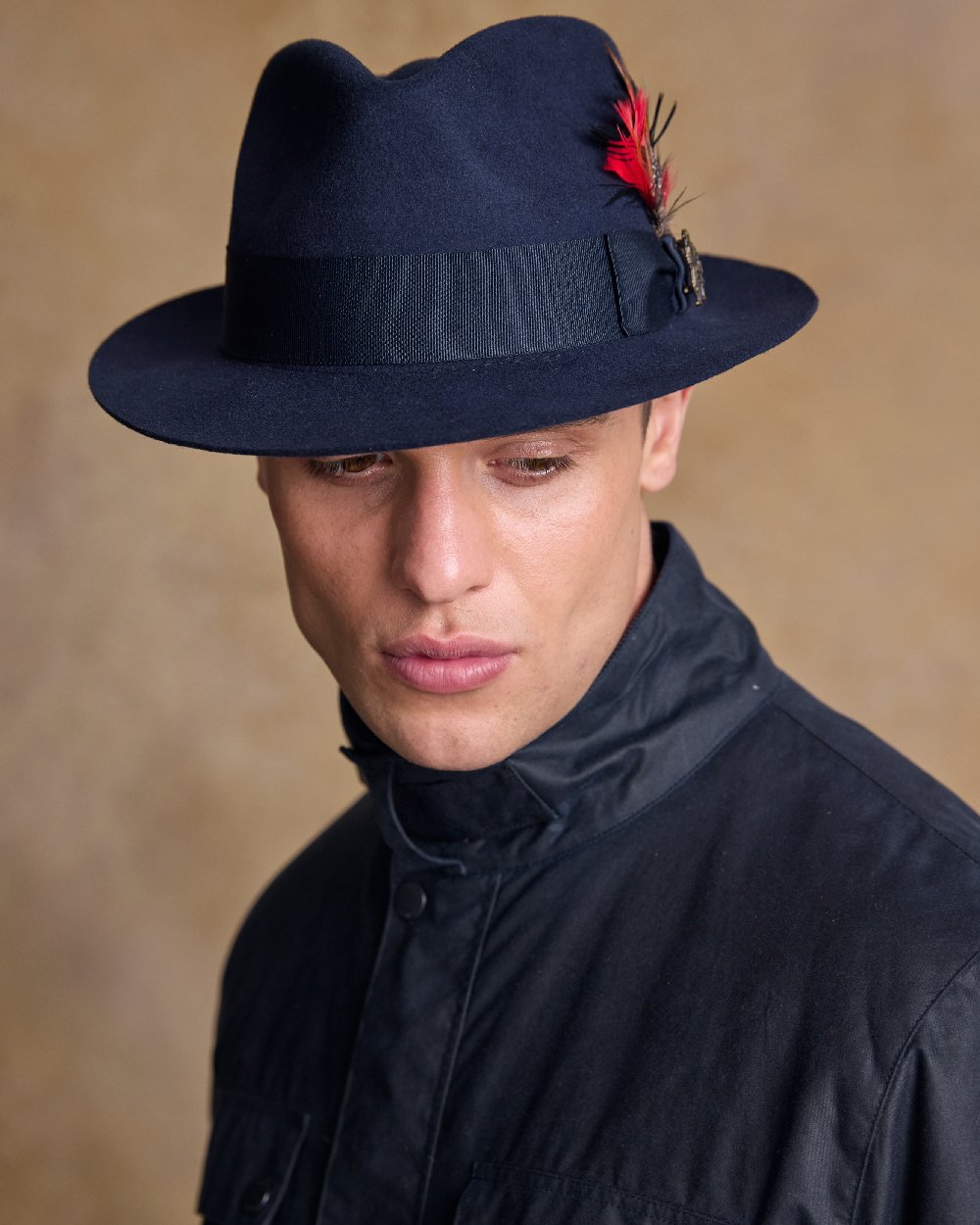 Navy Coloured Jack Murphy Mens Kildare Trilby Felt Hat on indoor background 