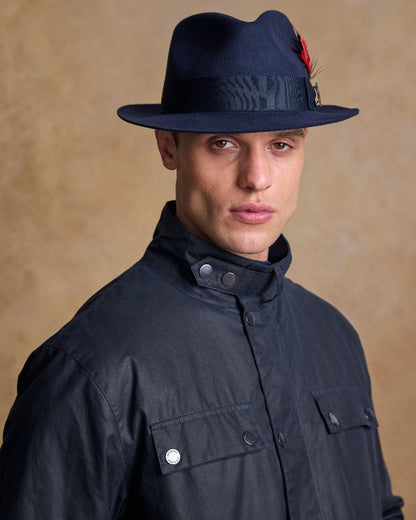 Navy Coloured Jack Murphy Mens Kildare Trilby Felt Hat on indoor background 