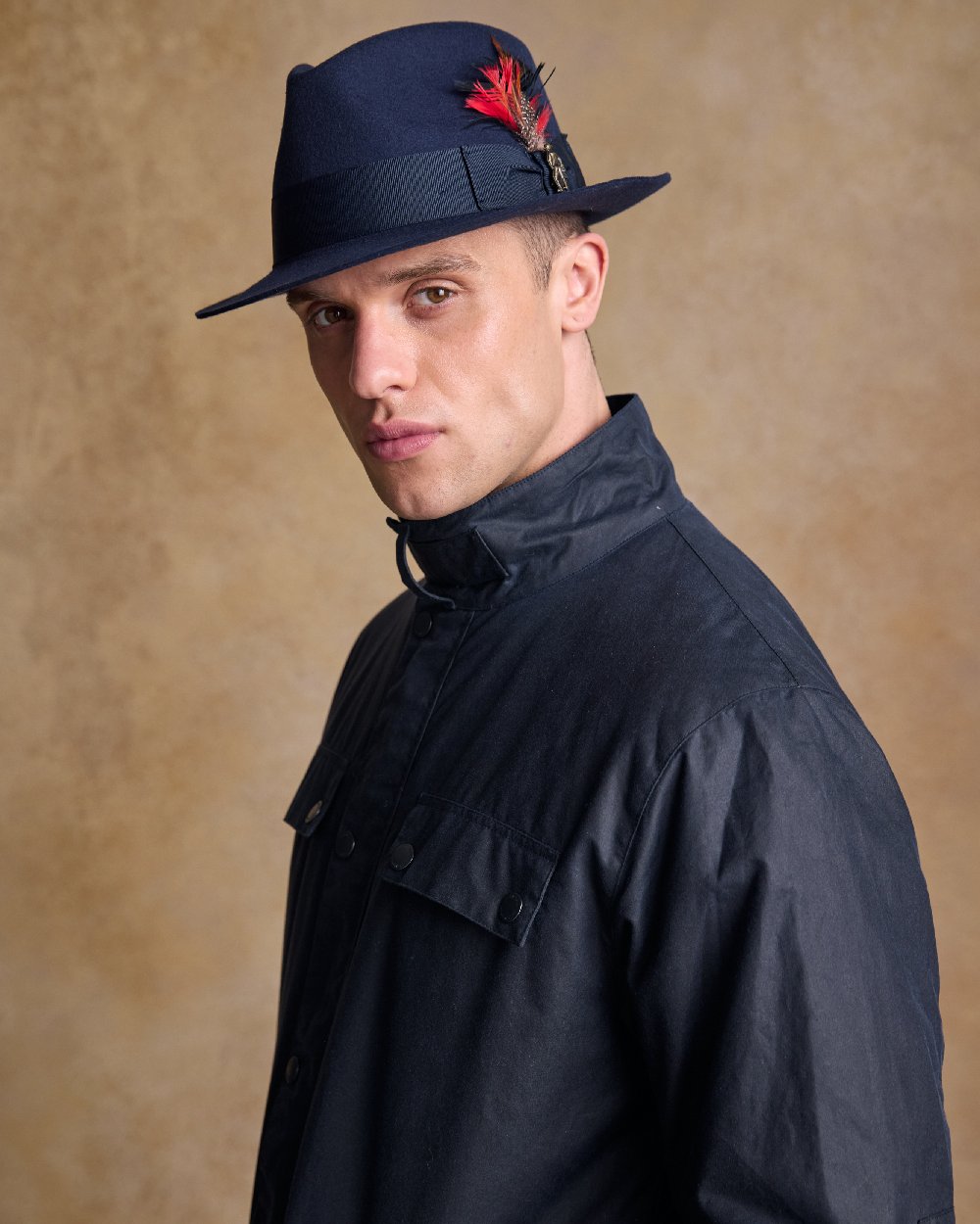 Navy Coloured Jack Murphy Mens Kildare Trilby Felt Hat on indoor background 