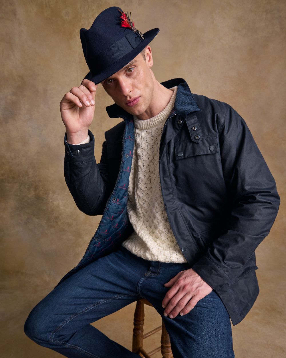 Navy Coloured Jack Murphy Mens Kildare Trilby Felt Hat on indoor background 