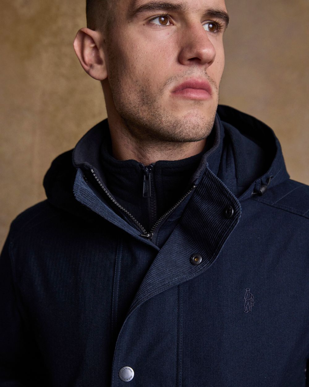 Navy Coloured Jack Murphy Mens Michael Waterproof Jacket on indoor background 