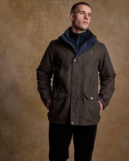 Olive Coloured Jack Murphy Mens Michael Waterproof Jacket on indoor background 