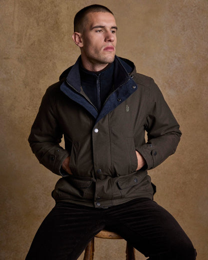 Olive Coloured Jack Murphy Mens Michael Waterproof Jacket on indoor background 