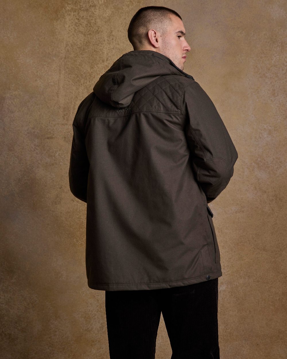 Olive Coloured Jack Murphy Mens Michael Waterproof Jacket on indoor background 