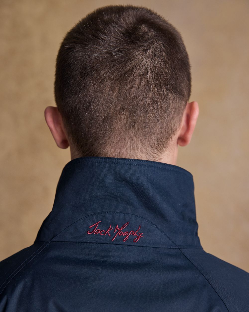 Heritage Navy Coloured Jack Murphy Mens Rockall Waterproof Jacket on indoor background 