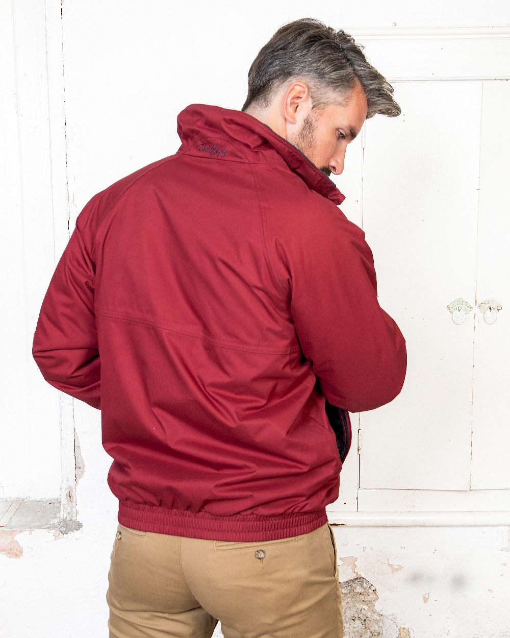 Red Coloured Jack Murphy Mens Rockall Waterproof Jacket on indoor background 