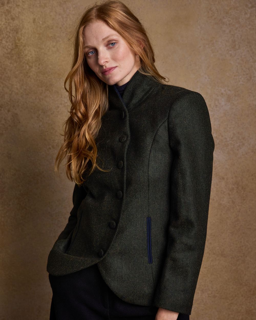 Deep Green Herringbone Coloured Jack Murphy Nicole Ladies Tweed Jacket on indoor background 
