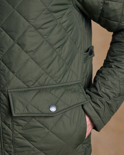 Olive coloured Jack Murphy Ronan Quilted Jacket on wall background 
