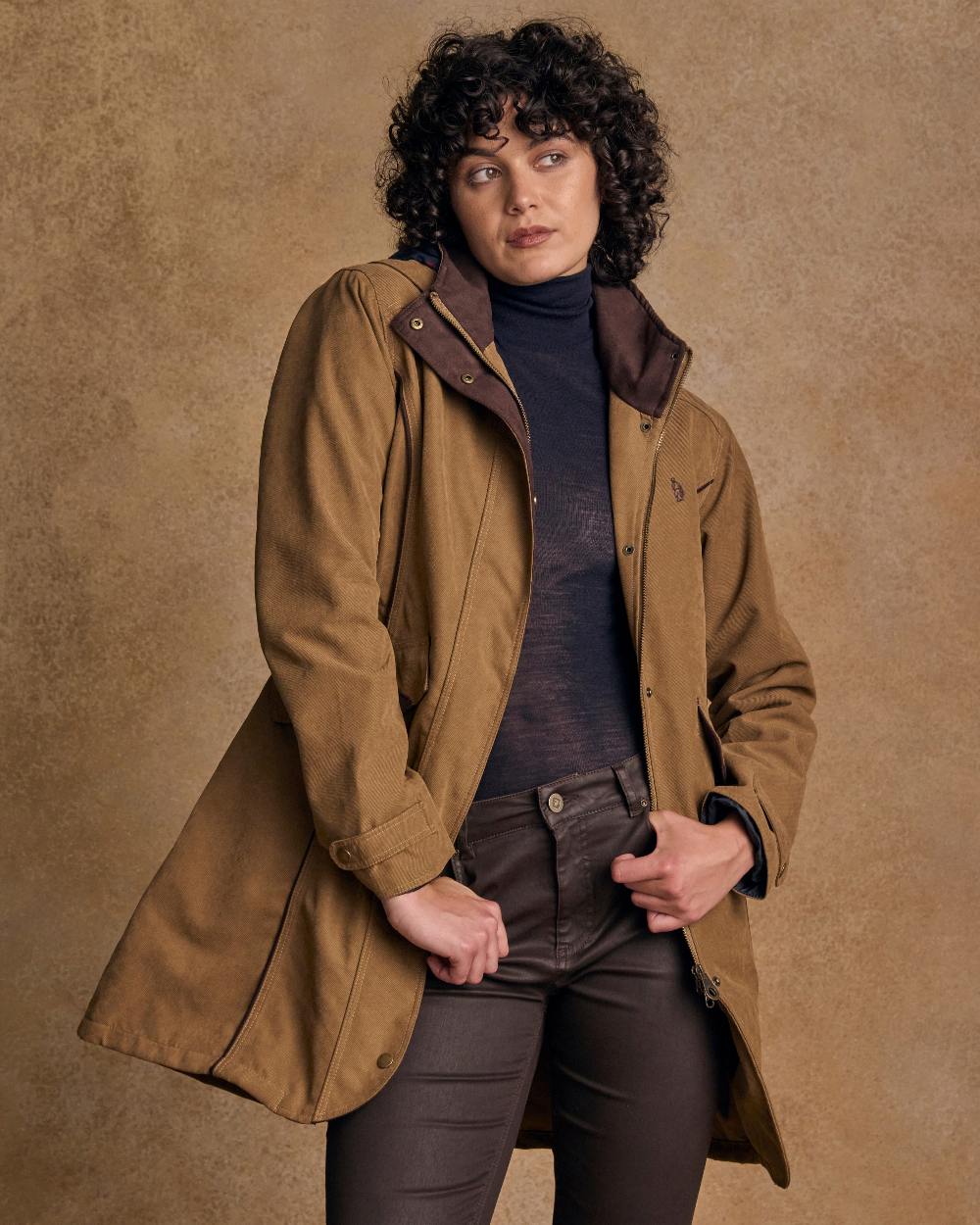 Camel Coloured Jack Murphy Una 3/4 Waterproof Coat on indoor background 