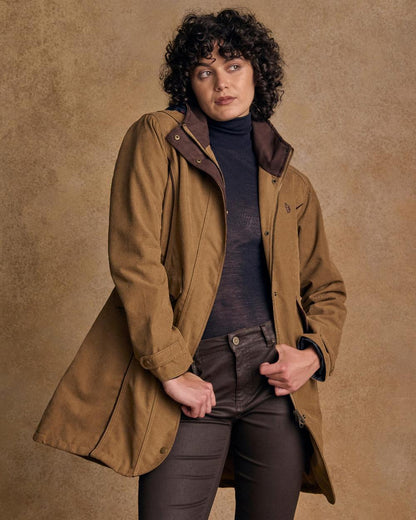 Camel Coloured Jack Murphy Una 3/4 Waterproof Coat on indoor background 