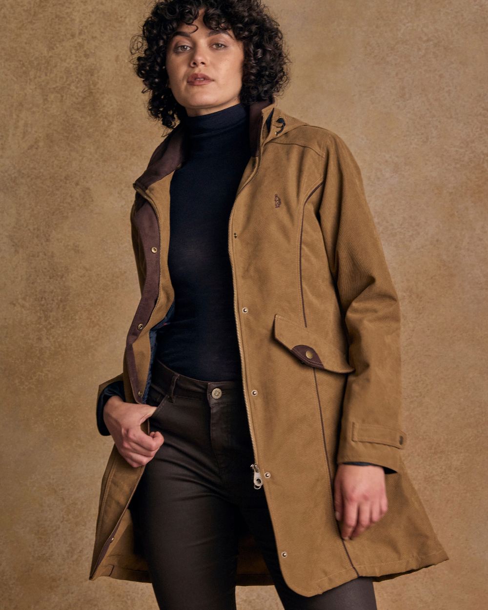 Camel Coloured Jack Murphy Una 3/4 Waterproof Coat on indoor background 