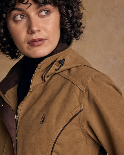 Camel Coloured Jack Murphy Una 3/4 Waterproof Coat on indoor background 