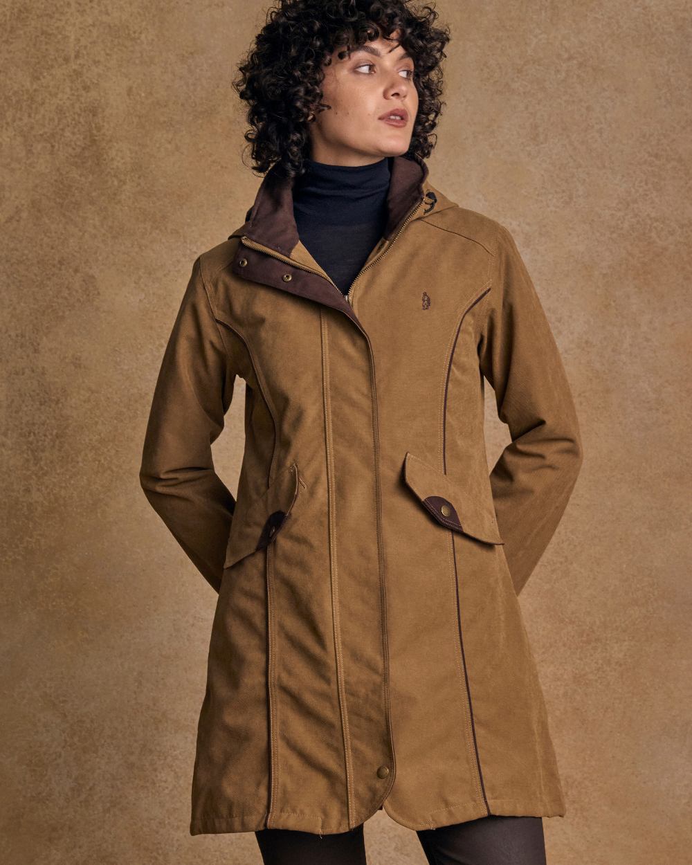 Camel Coloured Jack Murphy Una 3/4 Waterproof Coat on indoor background 