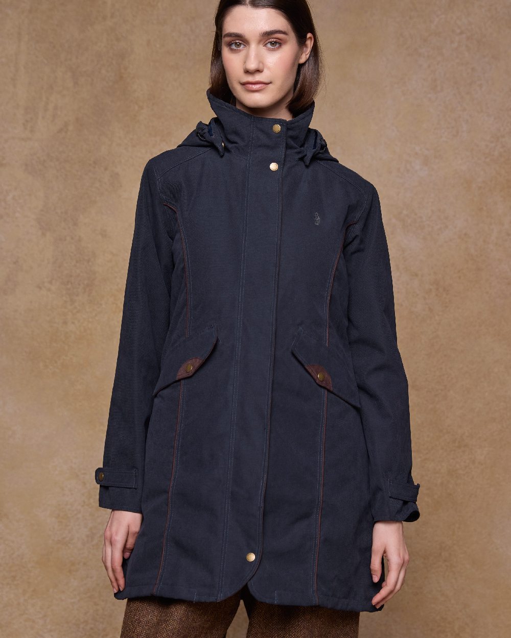 Navy Coloured Jack Murphy Una 3/4 Waterproof Coat on indoor background 