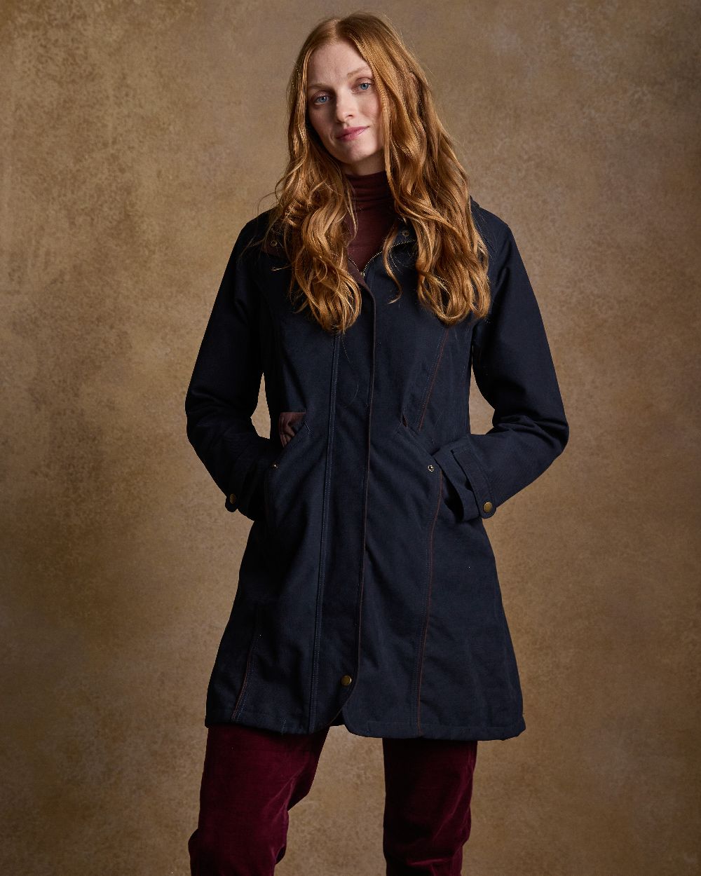 Heritage Navy Coloured Jack Murphy Una 3/4 Waterproof Coat on indoor background 