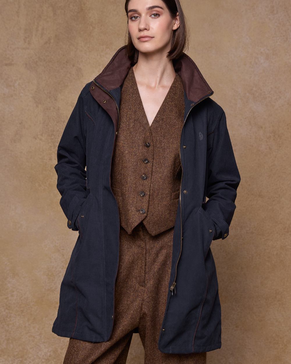 Heritage Navy Coloured Jack Murphy Una 3/4 Waterproof Coat on indoor background 