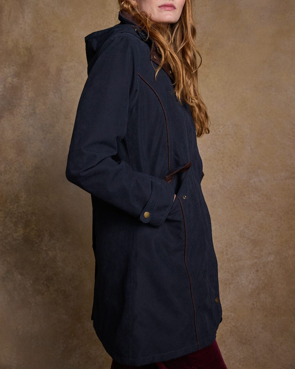 Heritage Navy Coloured Jack Murphy Una 3/4 Waterproof Coat on indoor background 