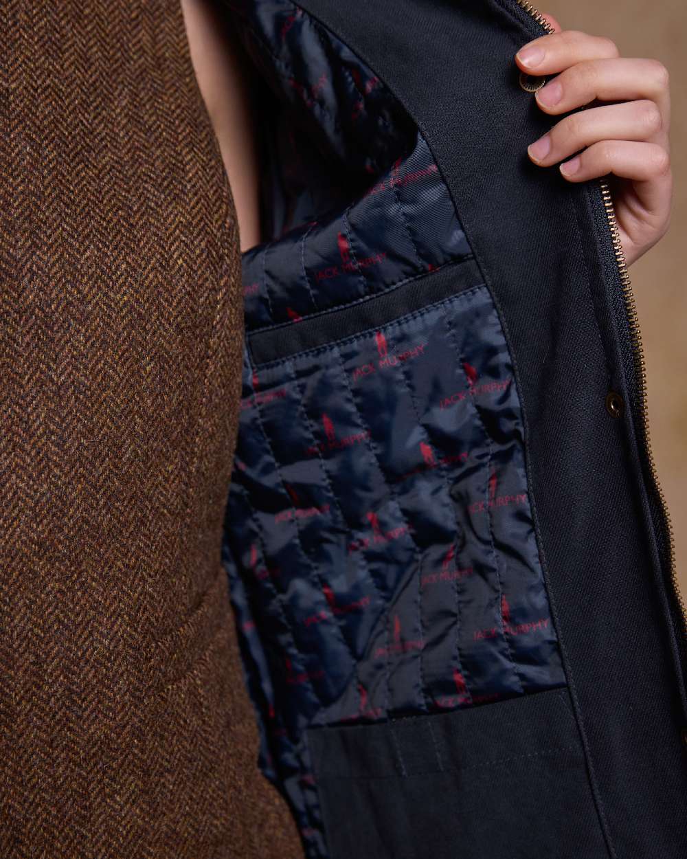 Navy Coloured Jack Murphy Una 3/4 Waterproof Coat on indoor background 