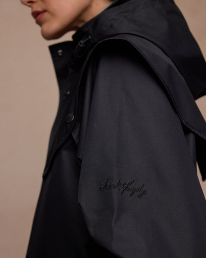 Black Coloured Jack Murphy Womens Connemara Waterproof Coat on indoor background 