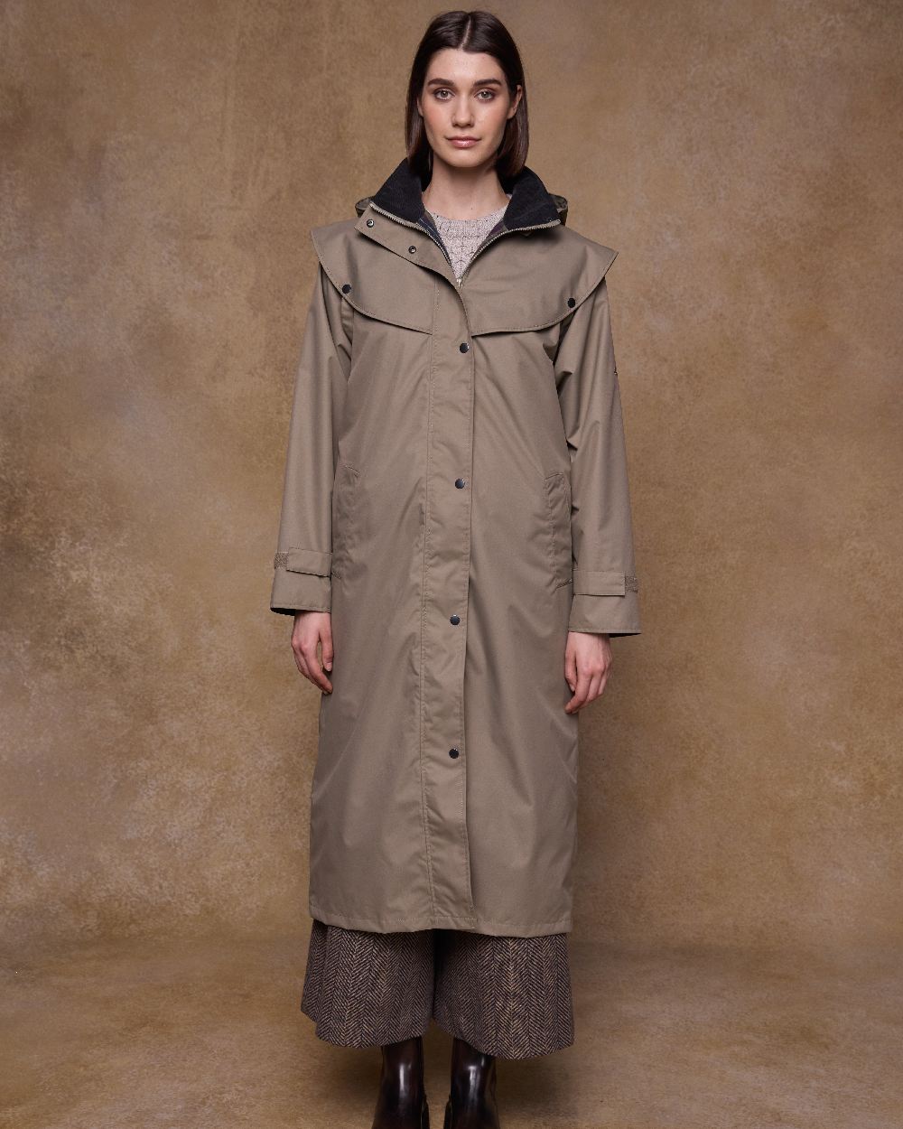 Chinchilla Coloured Jack Murphy Womens Connemara Waterproof Coat on indoor background 