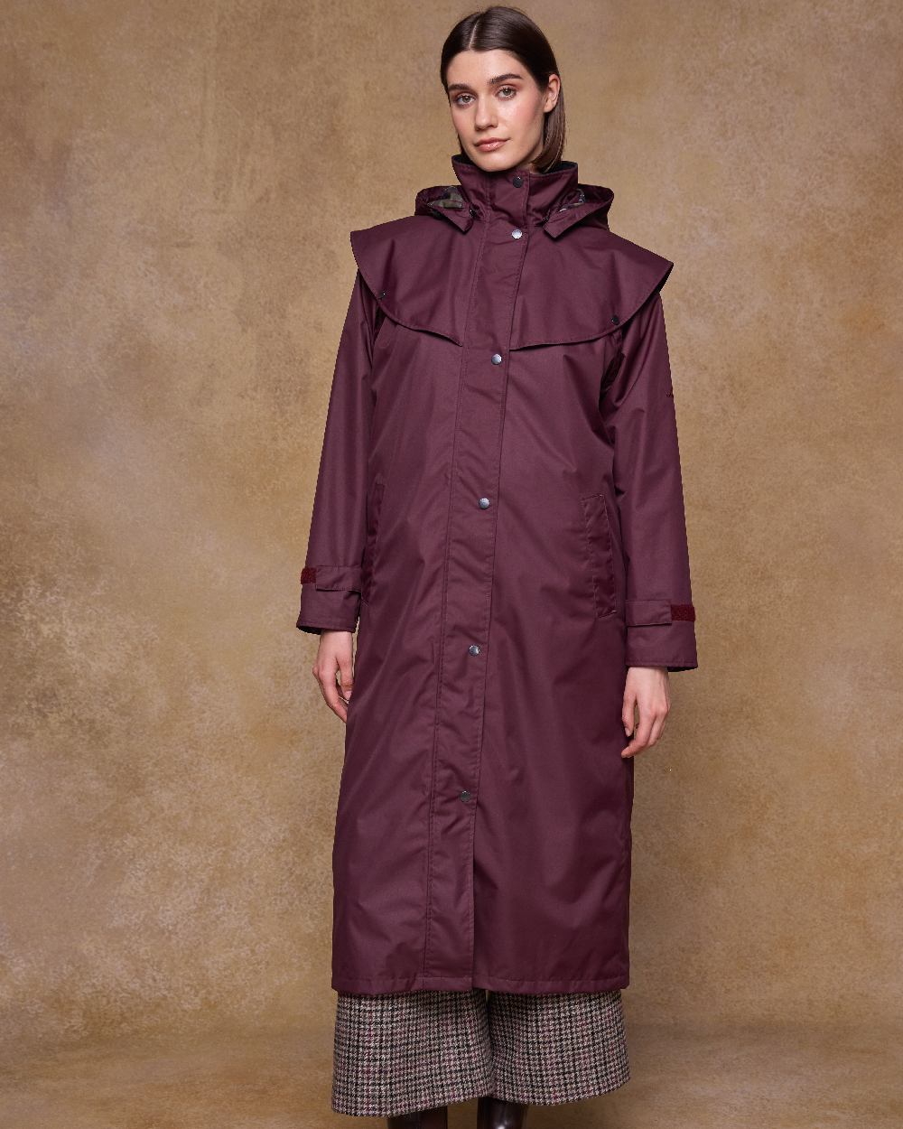 Deep Claret Coloured Jack Murphy Womens Connemara Waterproof Coat on indoor background 