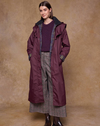 Deep Claret Coloured Jack Murphy Womens Connemara Waterproof Coat on indoor background 