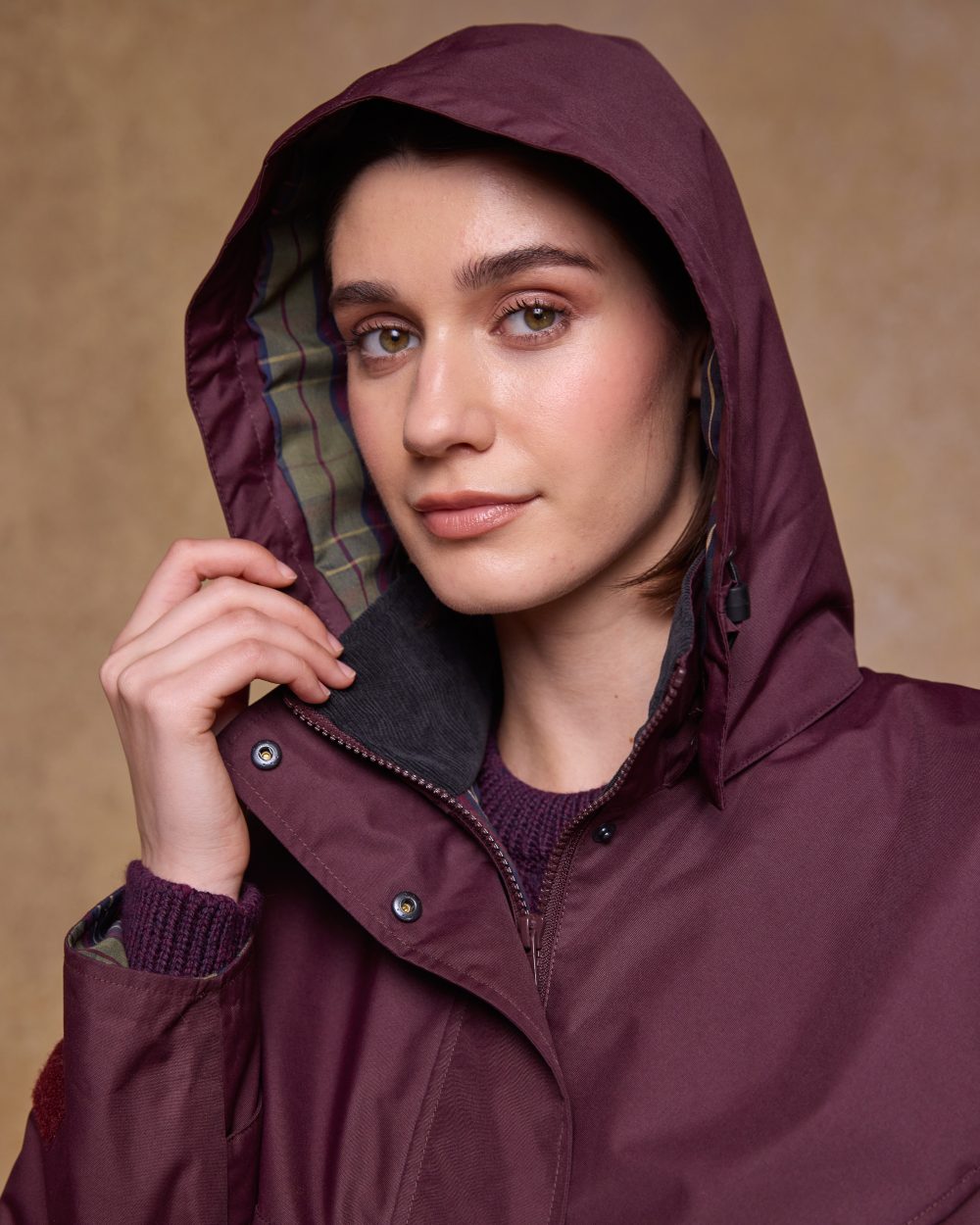 Deep Claret Coloured Jack Murphy Womens Connemara Waterproof Coat on indoor background 