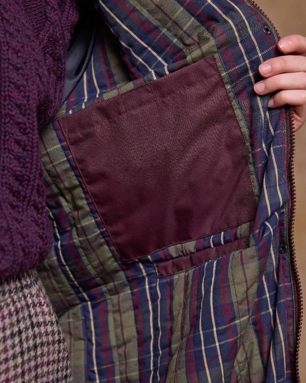 Deep Claret Coloured Jack Murphy Womens Connemara Waterproof Coat on indoor background 