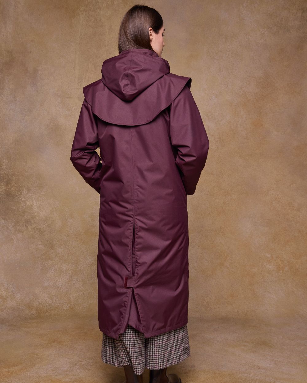 Deep Claret Coloured Jack Murphy Womens Connemara Waterproof Coat on indoor background 
