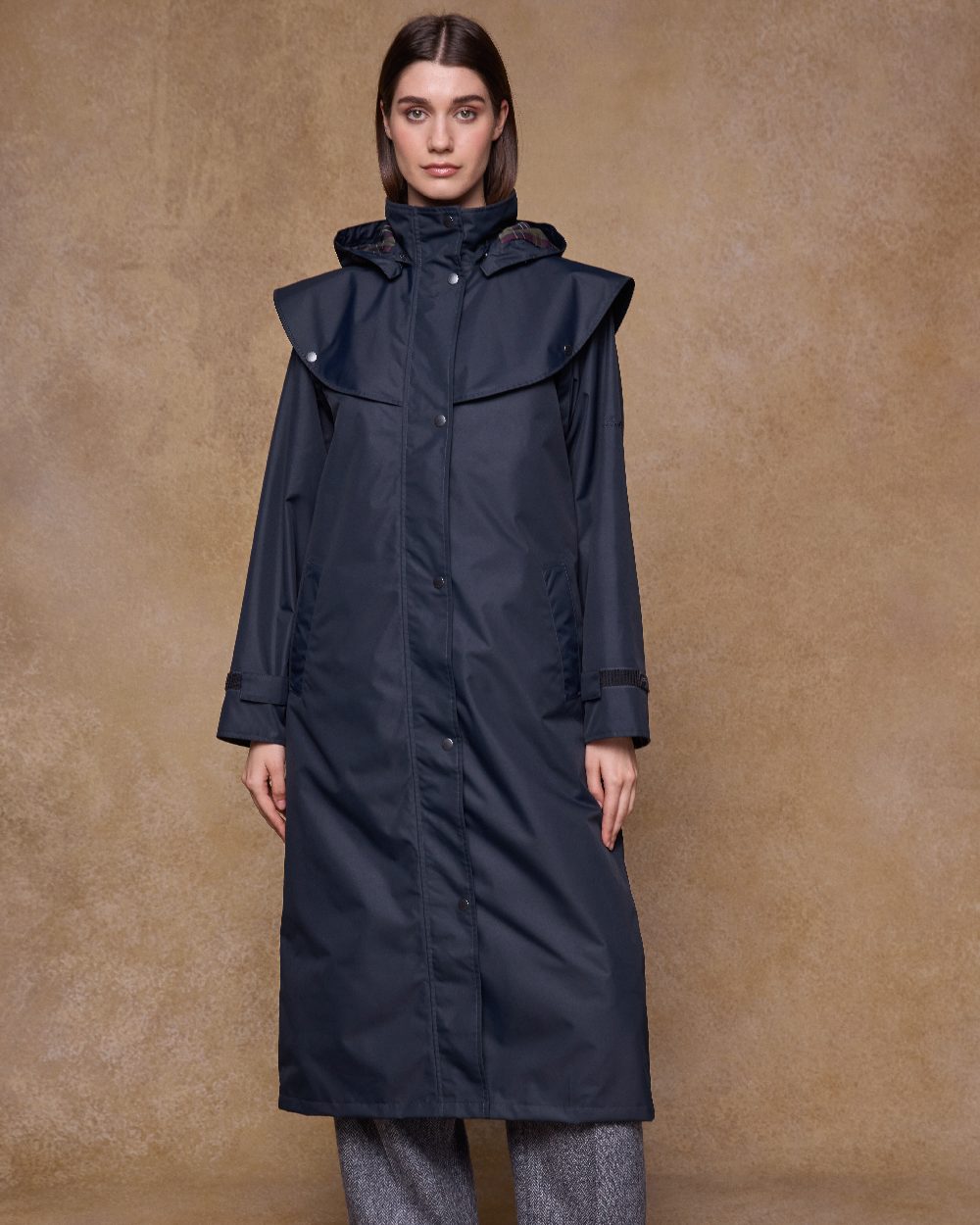 Navy Coloured Jack Murphy Womens Connemara Waterproof Coat on indoor background 