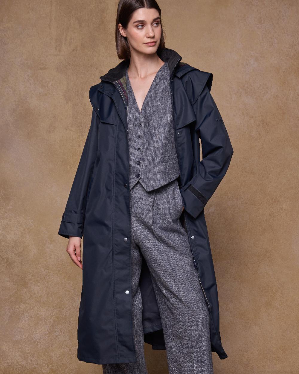 Navy Coloured Jack Murphy Womens Connemara Waterproof Coat on indoor background 