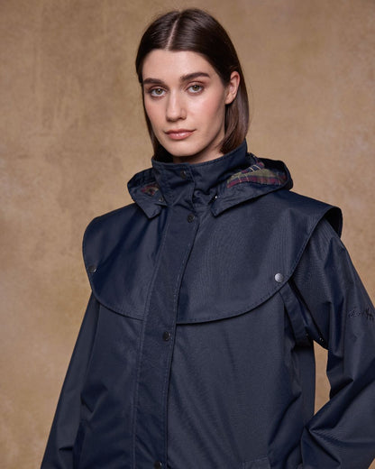 Navy Coloured Jack Murphy Womens Connemara Waterproof Coat on indoor background 