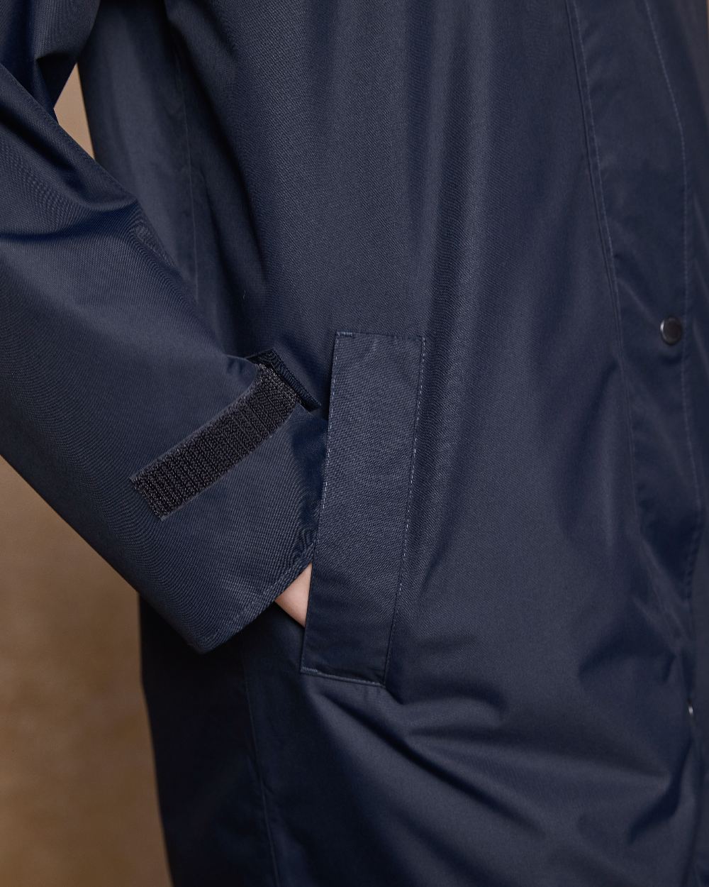 Navy Coloured Jack Murphy Womens Connemara Waterproof Coat on indoor background 
