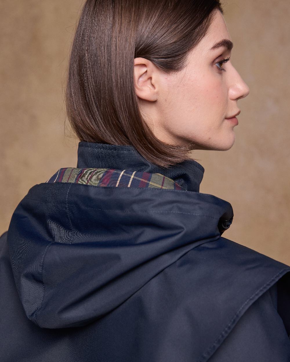 Navy Coloured Jack Murphy Womens Connemara Waterproof Coat on indoor background 